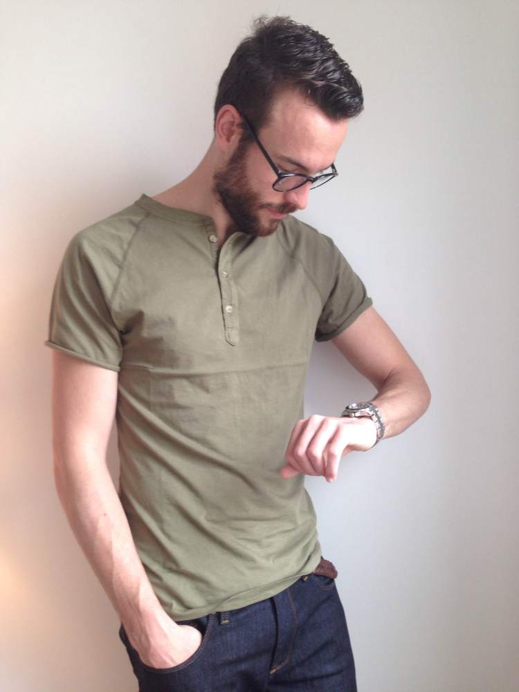 What started as a functional shirt for British rowers is now a style staple. Short-sleeve olive henley by Pistol Lake. Dark denim by Mott & Bow. Glasses by Warby Parker. Stainless steel dive watch by Invicta.