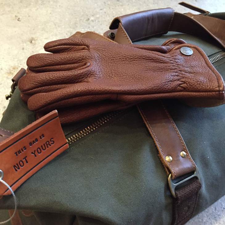 Dependable travel gear to fight the cold and stay stylish. Buffalo Bobber Gloves by Iron & Resin. Mt. Drew Duffle by United By Blue.